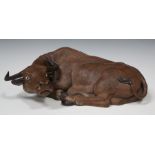 A Chinese stoneware model of a recumbent water buffalo, 20th century, finely modelled with head