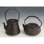 A Japanese iron tetsubin (tea kettle) and cover, Meiji period, the body of coppered tapering form,