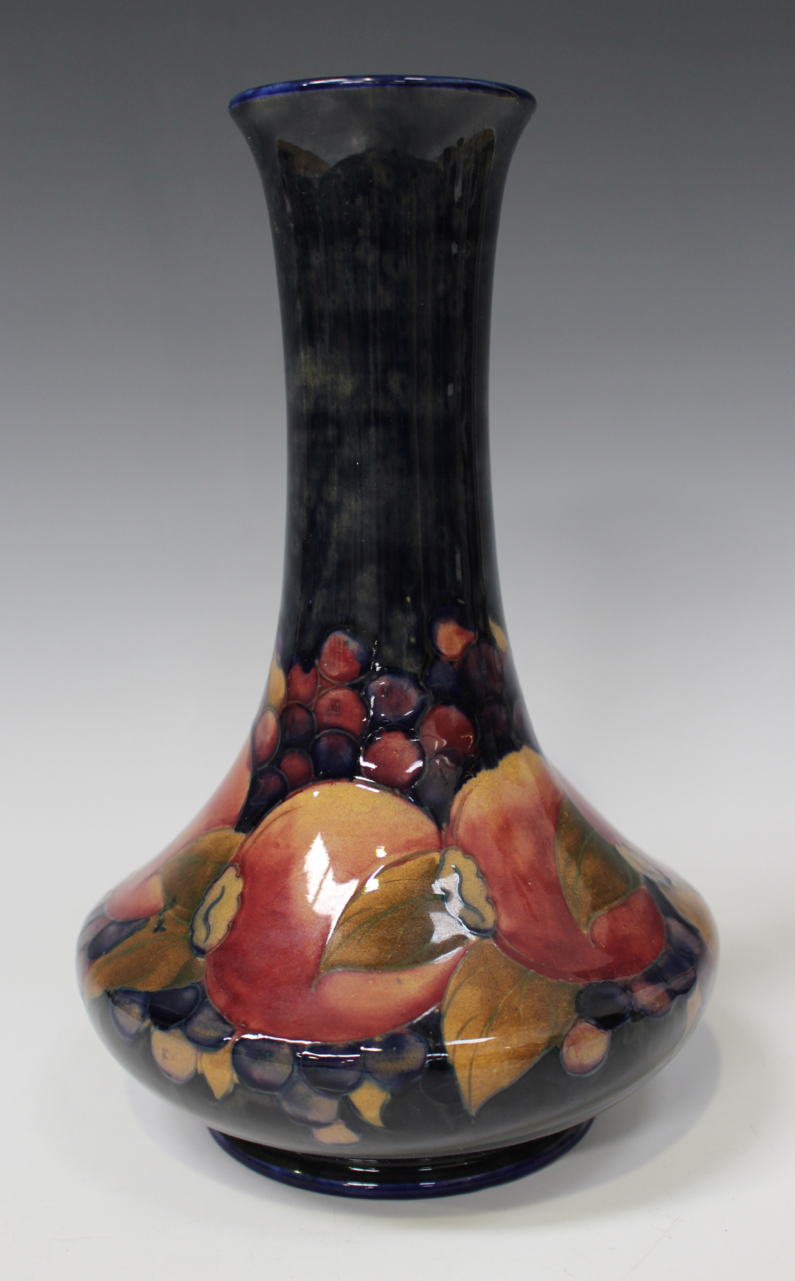 A Moorcroft pottery vase, circa 1918-1929, the low bellied body and slightly flared narrow neck