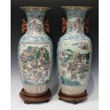 A near pair of Chinese famille rose turquoise ground porcelain vases, mark of Daoguang but 20th