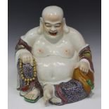 A Chinse famille rose porcelain figure of Buddha, 20th century, modelled in a seated pose, height