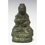 A Chinese bronze figure of Guanyin, Ming dynasty or earlier, modelled seated in dhyanasana on a