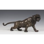 A Japanese brown patinated cast bronze figure of a tiger, Meiji/Taisho period, modelled standing