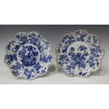 A pair of Chinese blue and white leaf shaped dishes, Kangxi period, each centre painted with