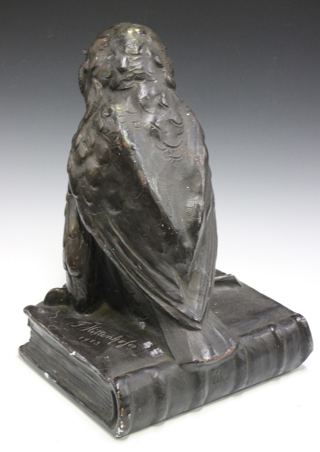 An early 20th century German bronzed cast plaster model of an owl seated on a quill and book, - Image 4 of 4