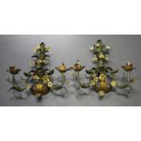 A pair of mid-20th century French tole painted wrought metal twin light wall sconces of foliate form