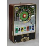 A mid-20th century German wall mounted roulette style gaming machine, named 'Union-Luxus' by 'Th.