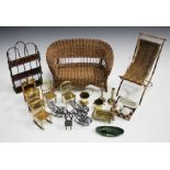 A collection of mainly late 19th century dolls and doll's house furniture, including a gilt metal