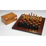 An early 20th century turned boxwood and ebony Staunton chess set, with weighted bases, height of