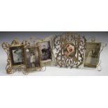 A late Victorian pierced brass photograph frame in the form of an 'N' within entwined foliate