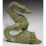 A pair of early 20th century carved and painted wall mounts, each in the form of a swan's head,