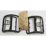 A pair of George III steel shoe buckles of typical curved form, length 7cm, with attached piece of