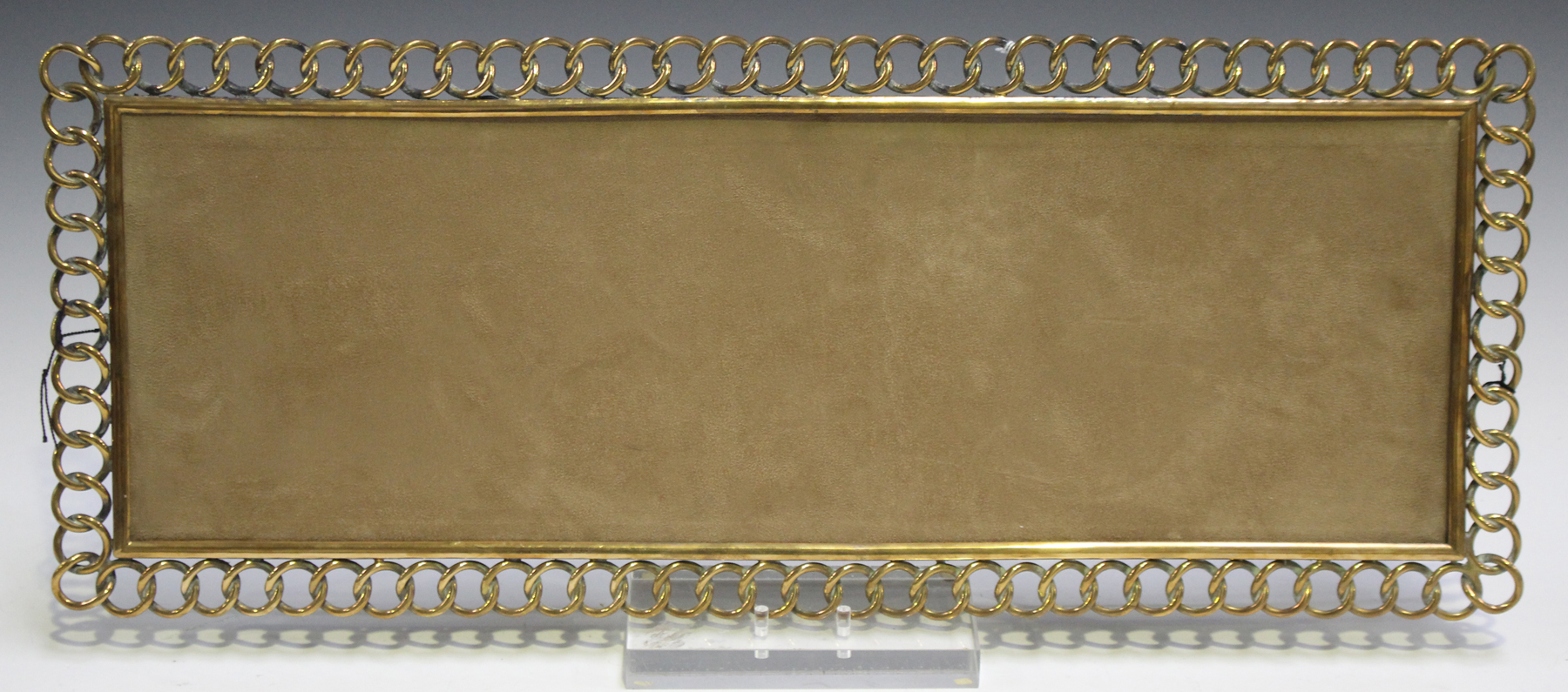 A late 19th century brass rectangular frame of chainlink form, the back with folding strut