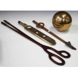 An early 20th century wooden stocking driers, length 95cm, a pair of wooden tongs, an electric