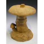 An early 20th century Continental pottery model of a mushroom, raised on a naturalistic base, height