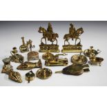 A good collection of mainly Victorian brass novelty items, including two miniature models of