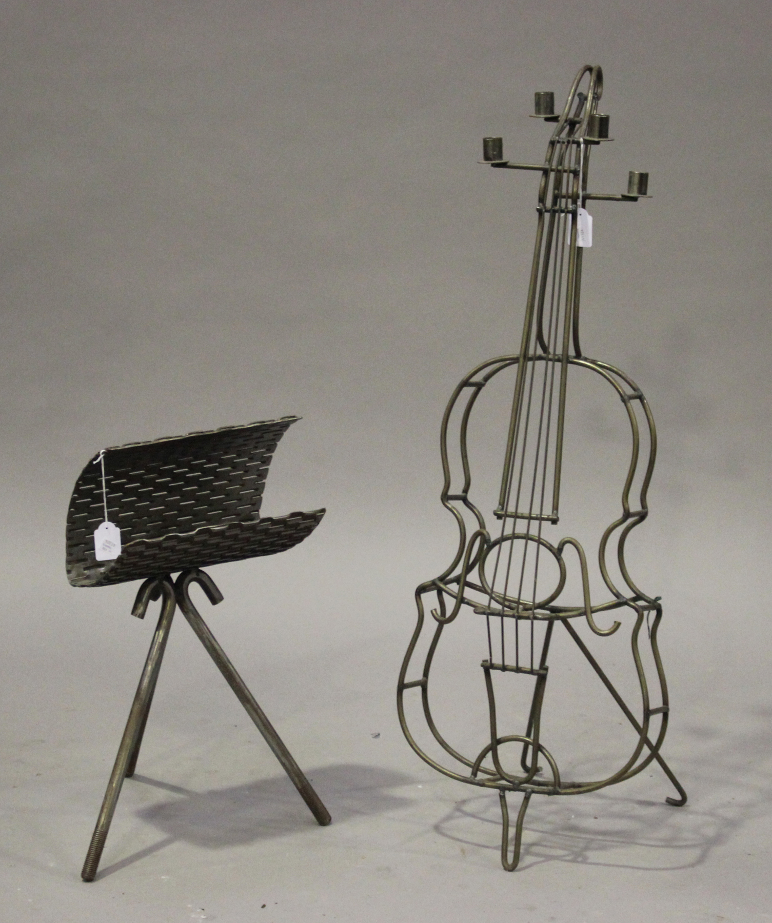 A late 20th century wrought iron novelty floor standing candelabrum in the form of a cello, height