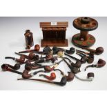 A collection of assorted pipes and two pipe racks.Buyer’s Premium 29.4% (including VAT @ 20%) of the