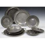 A group of 18th and 19th century pewter, comprising two chargers, two serving platters, four
