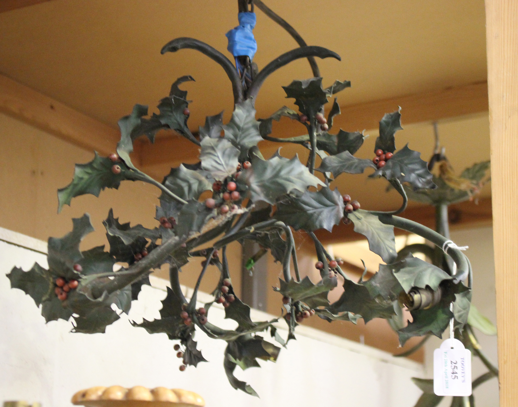 An early 20th century French tole painted wrought metal three light chandelier, worked as overall