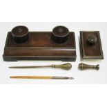 A late 19th century French bronze desk set, comprising an inkstand of rectangular form with two