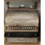 A late 19th century brass cased National counter-top cash register with overall cast foliate