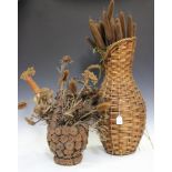 A mid-20th century French basket weave jug containing ornamental bulrushes, height of jug 67cm,