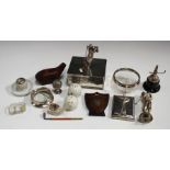 A collection of golf related collectors' items, including a silver desk clip in the form of two