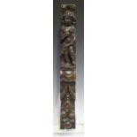 An 18th century oak pilaster, carved in the form of a standing putto above fruit and leaf swags,
