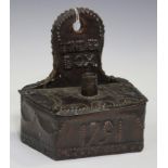 A copper mounted wall hanging tinder box, the wooden base inscribed 'W. Palmer Bletchingdon 1836',