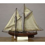 A scratch-built wooden model of 19th century fishing schooner, length 80cm, together with another