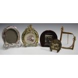 A late 19th century gilt metal and paste set photograph frame in the form of a horseshoe, height