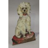 A late 19th/early 20th century French tole painted plate metal stick stand in the form of a seated