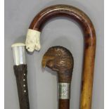 An early 20th century ash walking cane, the carved softwood handle modelled in the form of a