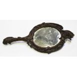 A 19th century French Rococo Revival finely carved walnut hand mirror of foliate scrolling form,