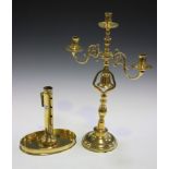 A 19th century Dutch brass tavern candelabrum, the three candle holders above an open support fitted