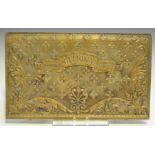 A 19th century brass fender frieze, other brass mounts, a National cash register panel and a