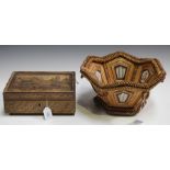 A 19th century French straw work box, the glazed lid decorated with a townscape, hinged to reveal