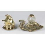 A 19th century cast brass novelty inkwell in the form of a parrot's head with inset glass eyes,