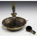 A late Victorian tinplate and brass novelty pricket candlestick in the form of an oversized