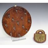 A late 19th/early 20th century French stained walnut circular wall plaque, fitted with a series of