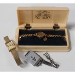 A Rotary 9ct gold cased lady's wristwatch, case width 1.6cm, on a gilt metal fronted bracelet,