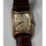 A Bulova gilt metal curved rectangular cased gentleman's wristwatch with signed movement, the signed