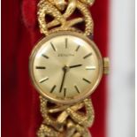 A Zenith 9ct gold lady's bracelet wristwatch, the signed circular gilt dial with black baton