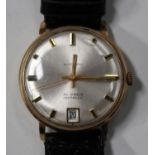 An Automatic gold circular cased gentleman's wristwatch, the silvered dial with baton numerals,
