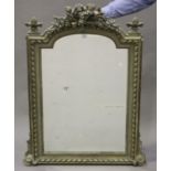 An early 20th century French painted overmantel mirror, the arched pediment with an arrow and quiver