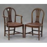 A set of eight 20th century George III style mahogany arched splat back dining chairs with drop-in