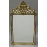 A late 20th century gilt framed sectional wall mirror with shell surmount and scroll decoration,