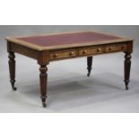 A mid-Victorian oak library table, the moulded top inset with red gilt-tooled leather above an