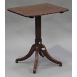 A Regency mahogany rectangular tip-top wine table, the octagonal column raised on four outswept